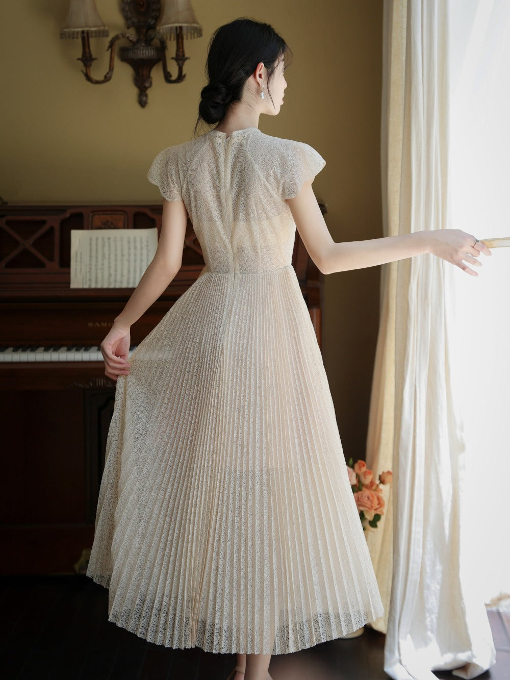 Embroidered pleated gown